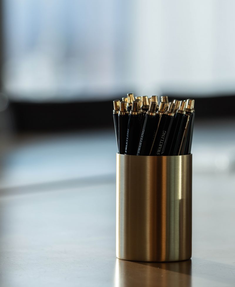 Pencils in pencil stand on table